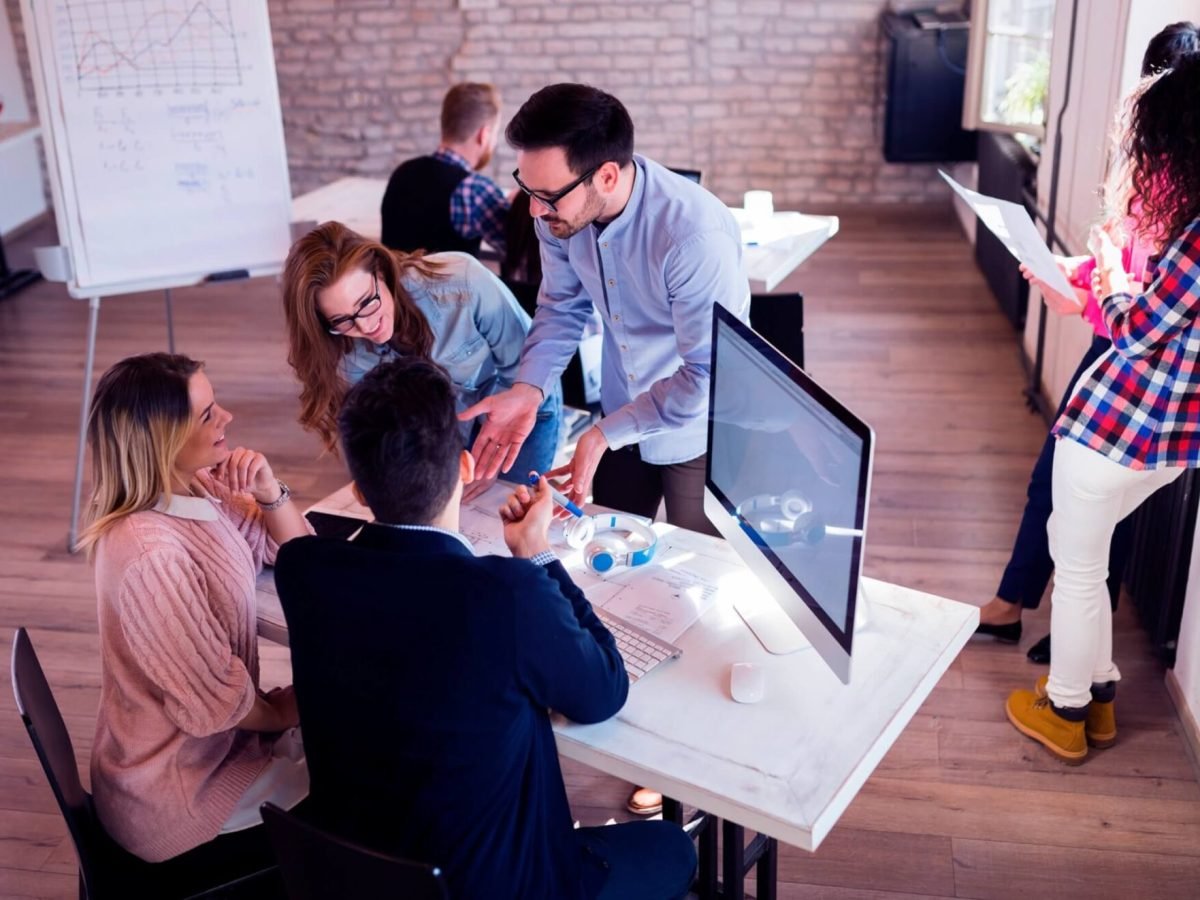 picture-of-young-architects-discussing-in-office-UGKJXLQ-scaled-1.jpg